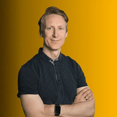 Portrait of a confident person in a dark shirt against a vibrant yellow background, symbolizing creativity and professionalism in video production for brands.