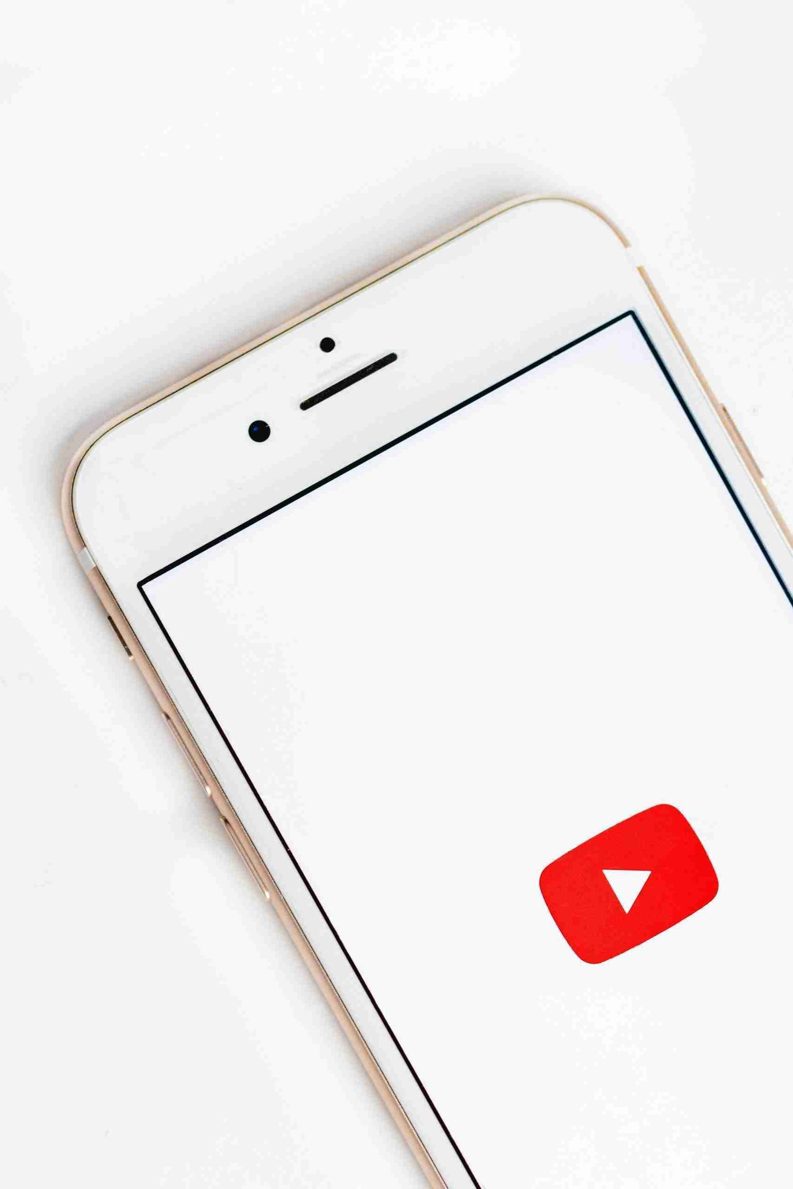 Smartphone displaying the YouTube app logo, representing vertical video marketing strategies for brand engagement in 2025.
