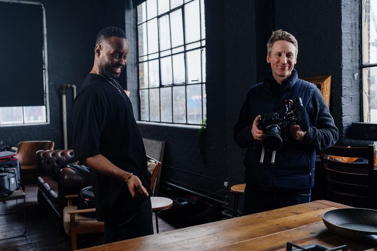 Video production behind-the-scenes in a kitchen studio.
